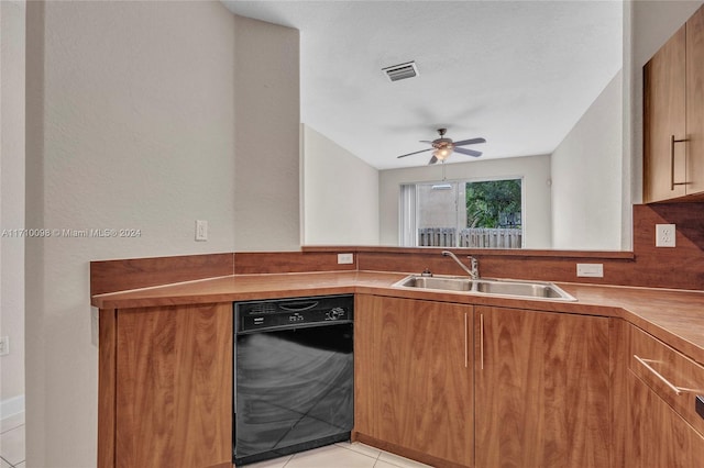 kitchen featuring dishwasher, ceiling fan, light tile patterned floors, and sink