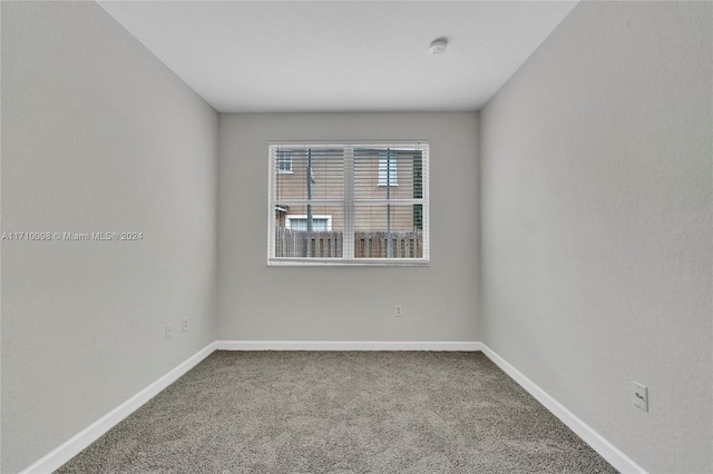 spare room featuring carpet flooring