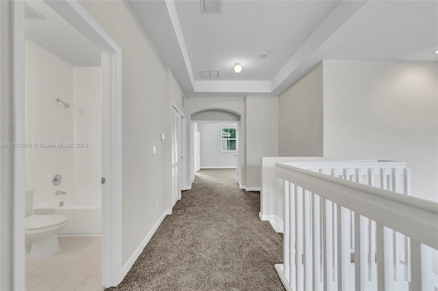 hallway featuring carpet flooring