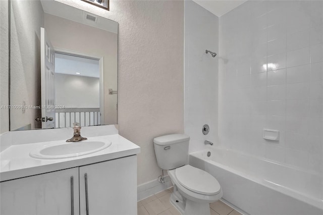 full bathroom featuring tile patterned flooring, vanity, toilet, and tiled shower / bath