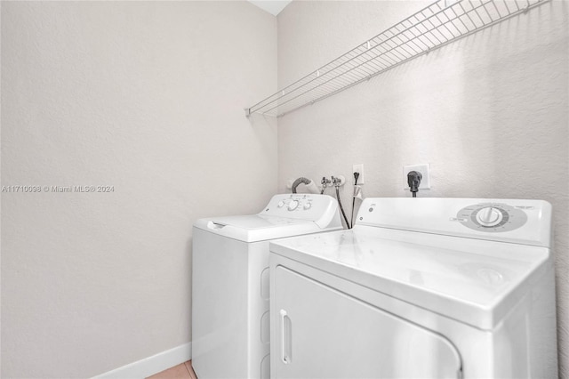 laundry room featuring separate washer and dryer