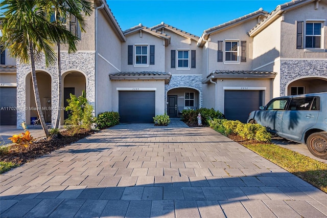 view of front of property with a garage