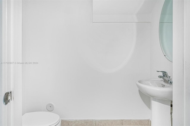 bathroom featuring tile patterned floors and toilet