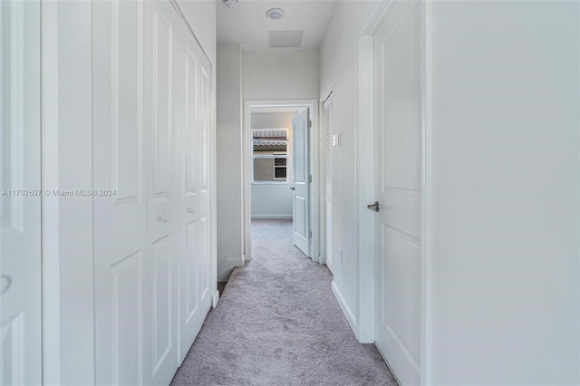 corridor with light colored carpet