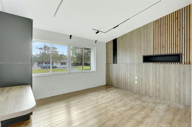 spare room featuring light hardwood / wood-style flooring