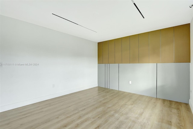 unfurnished room with light hardwood / wood-style floors