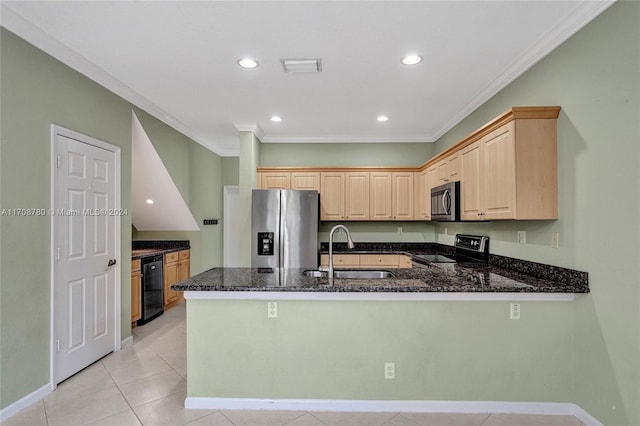 kitchen featuring dark stone counters, sink, ornamental molding, appliances with stainless steel finishes, and kitchen peninsula