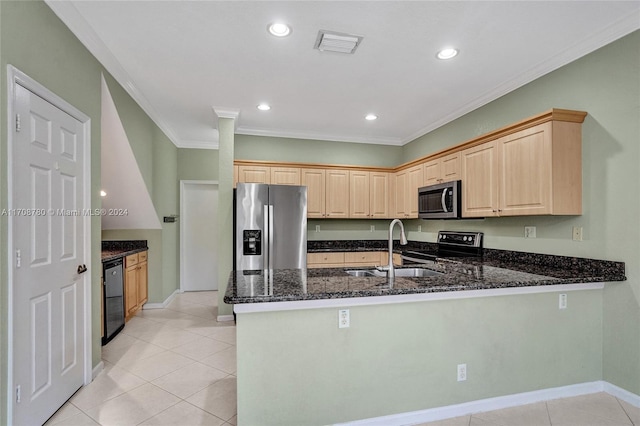 kitchen featuring black appliances, kitchen peninsula, sink, and dark stone counters