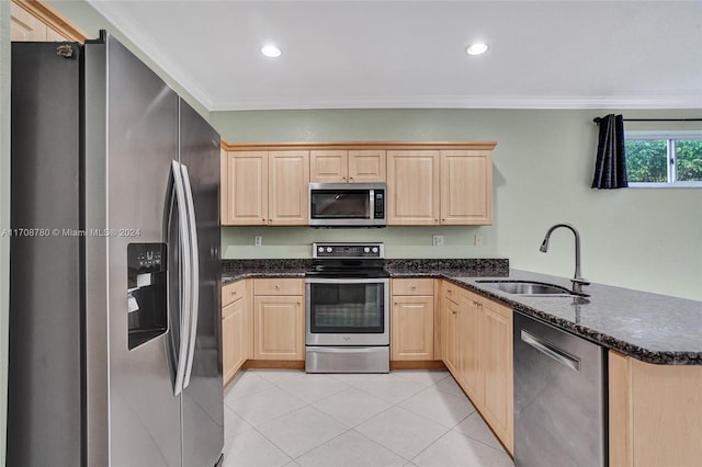 kitchen with sink, stainless steel appliances, kitchen peninsula, crown molding, and light brown cabinetry