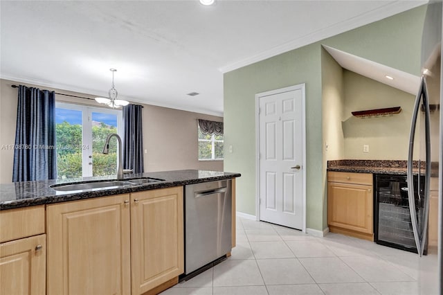 kitchen featuring stainless steel appliances, a wealth of natural light, crown molding, and sink