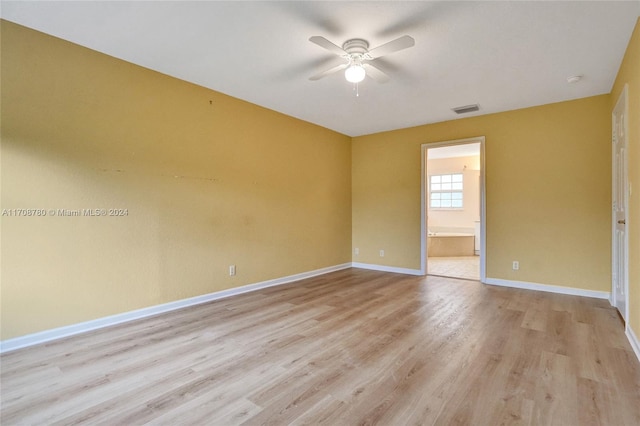 empty room featuring ceiling fan and light wood-type flooring