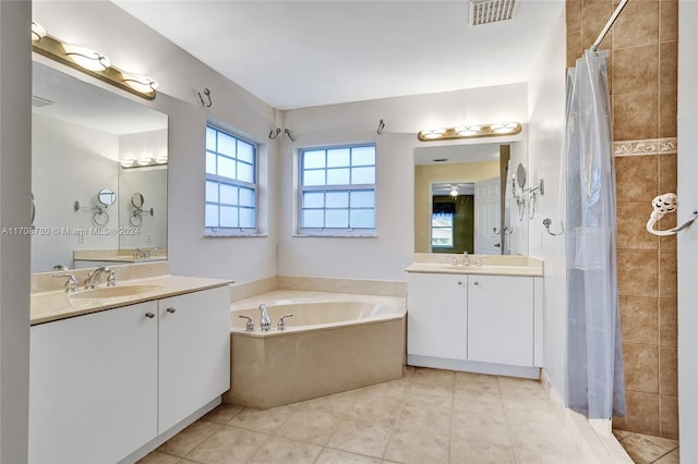 bathroom featuring tile patterned floors, vanity, and separate shower and tub