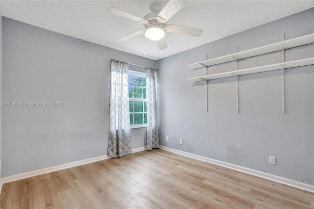 unfurnished room with ceiling fan and light hardwood / wood-style flooring