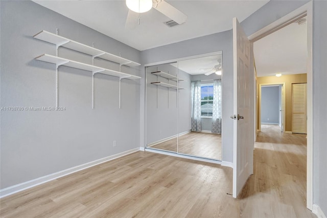 interior space featuring ceiling fan, a closet, and light hardwood / wood-style flooring