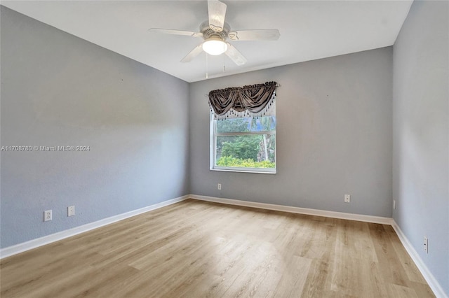 unfurnished room featuring ceiling fan and light wood-type flooring