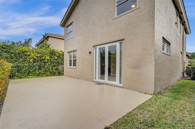 rear view of house featuring a patio