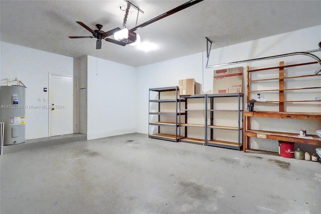 garage with electric water heater, ceiling fan, and a garage door opener