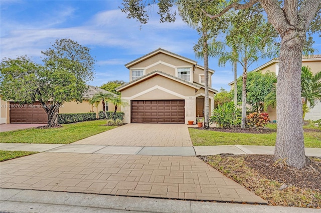 view of front facade featuring a front yard and a garage