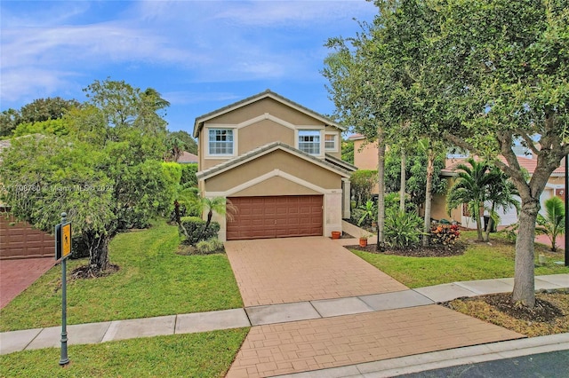 view of front facade with a front yard and a garage