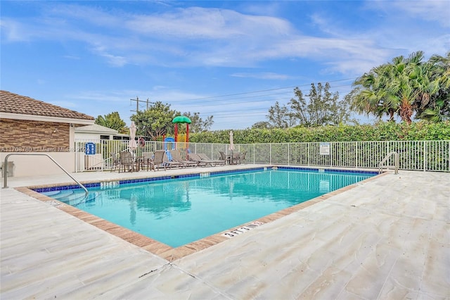 view of swimming pool featuring a patio