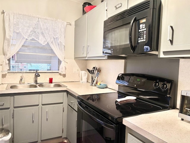 kitchen featuring black appliances and sink