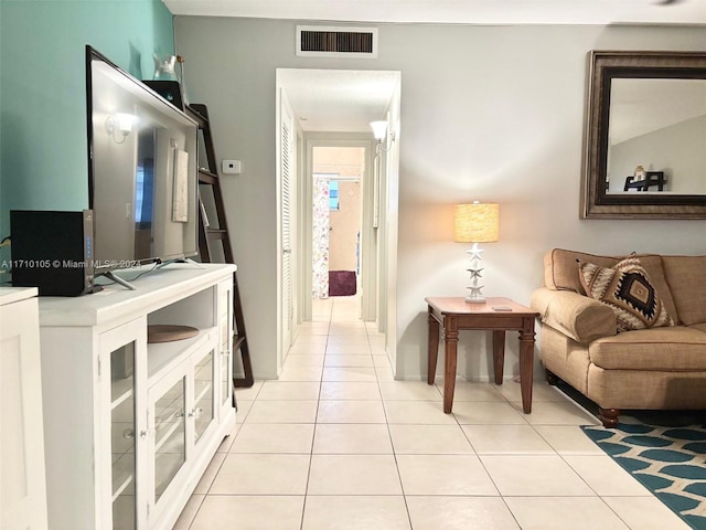 corridor featuring light tile patterned floors