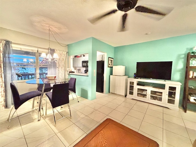 dining area with light tile patterned floors and ceiling fan with notable chandelier