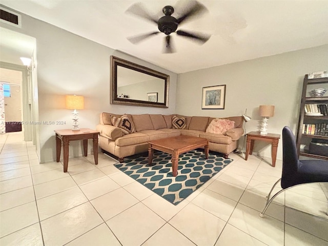 living room featuring ceiling fan and light tile patterned flooring