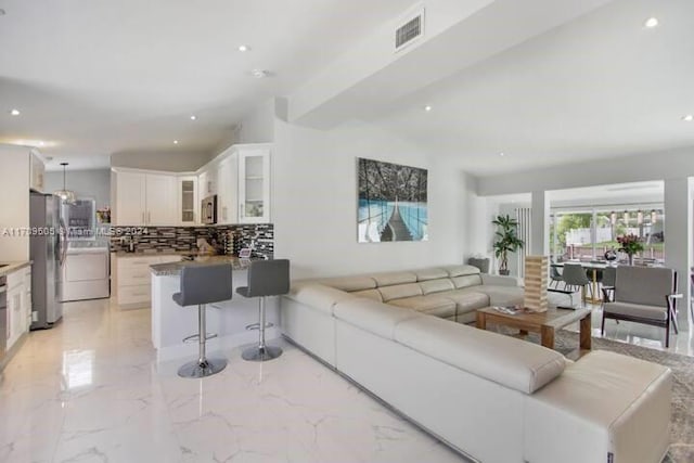 living room with washer / dryer