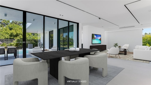 dining room featuring a wall of windows