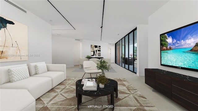 living room featuring floor to ceiling windows