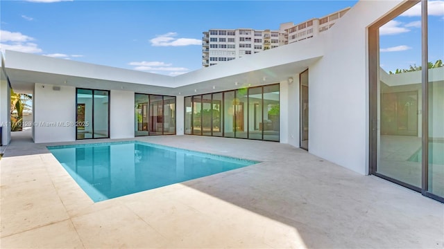 view of pool featuring a patio