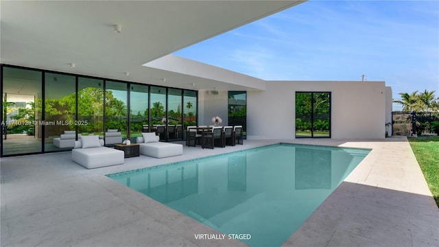 view of swimming pool featuring outdoor lounge area and a patio area