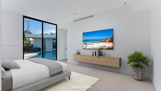 bedroom featuring floor to ceiling windows and access to exterior