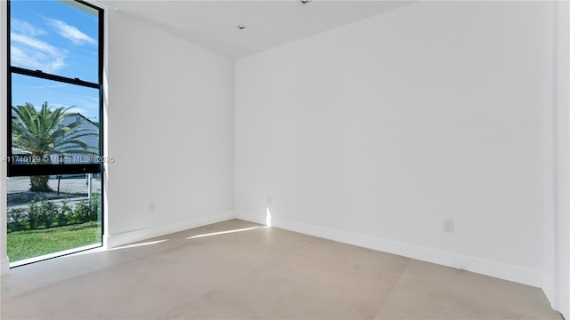 spare room featuring plenty of natural light