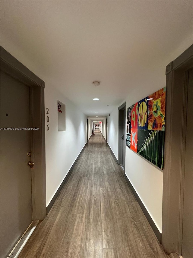 corridor featuring dark hardwood / wood-style flooring