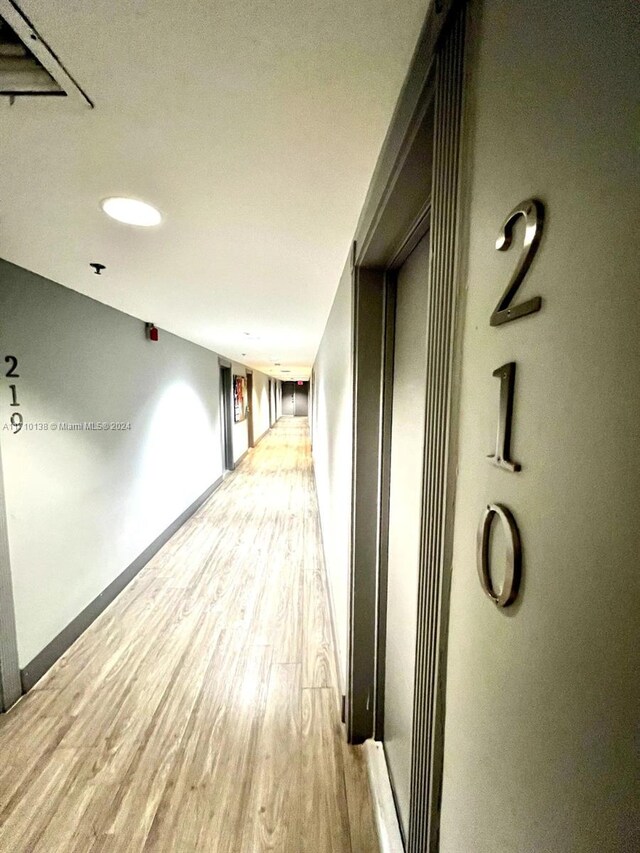 corridor featuring hardwood / wood-style floors