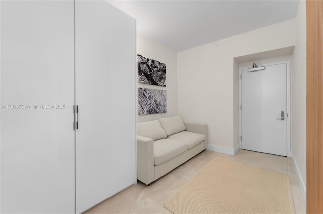 sitting room featuring light tile patterned flooring