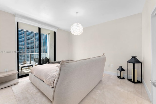 bedroom featuring a wall of windows