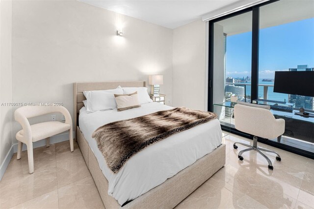 bedroom featuring expansive windows