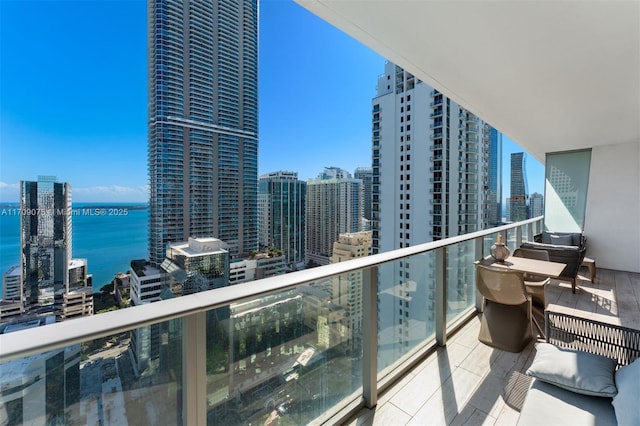 balcony featuring a water view