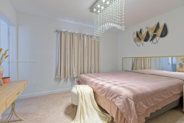 carpeted bedroom with an inviting chandelier