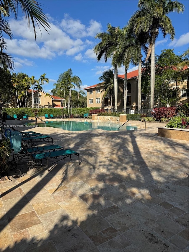 view of swimming pool with a patio