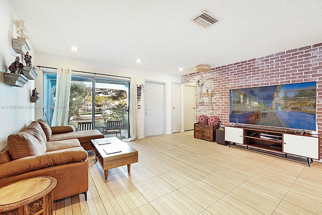 tiled living room with brick wall