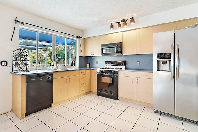 kitchen featuring light brown cabinets, sink, tasteful backsplash, a textured ceiling, and black appliances