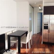 dining room with dark hardwood / wood-style flooring