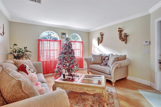 living room with light hardwood / wood-style flooring and ornamental molding