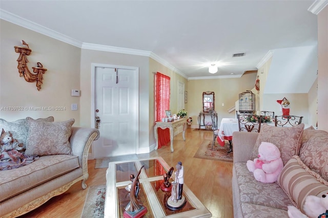 living room featuring light hardwood / wood-style floors and ornamental molding