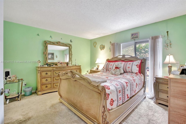 carpeted bedroom featuring a textured ceiling