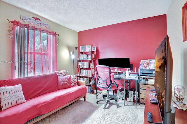 carpeted office featuring a textured ceiling